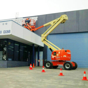 Duralift 45ft articulating knuckle boom lift extended over a building, showing boom lift working height and reach