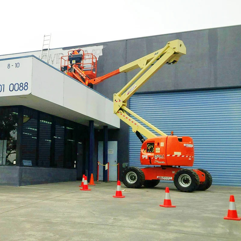 Duralift 45ft articulating knuckle boom lift extended over a building, showing boom lift working height and reach